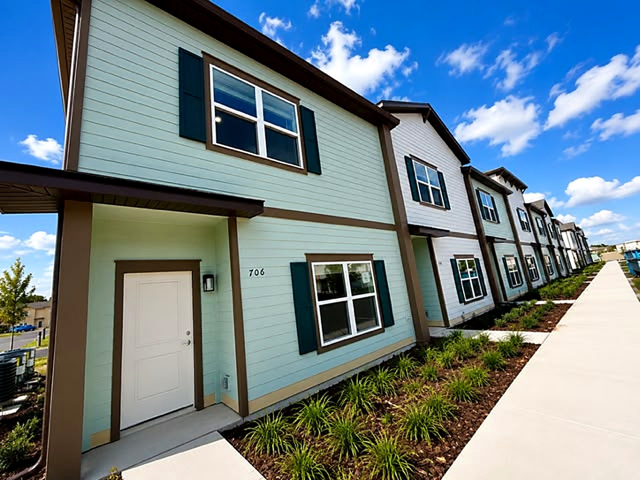 Completed landscaping and finished exteriors across the 82-unit townhome community
